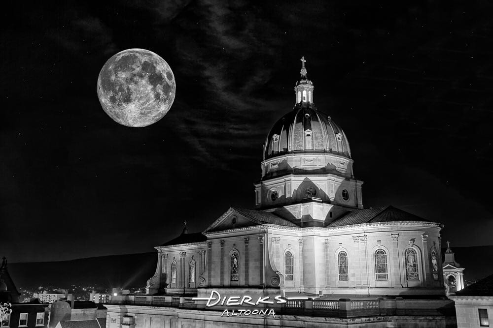 Altoona Cathedral at night under a full moon in black and white photography.