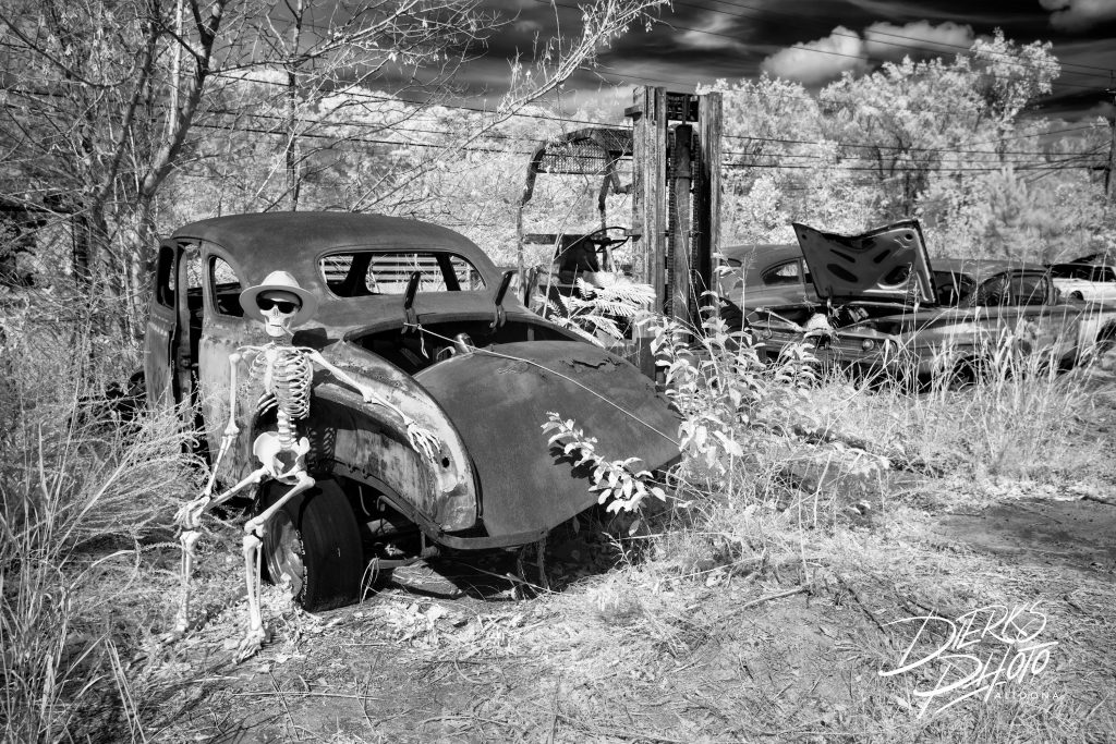 The skeleton valet for the Highway To Hell Hotel takes a smoke break on an old 1953 Plymouth coupe. Quality prints start at $29. © Andrew Dierks